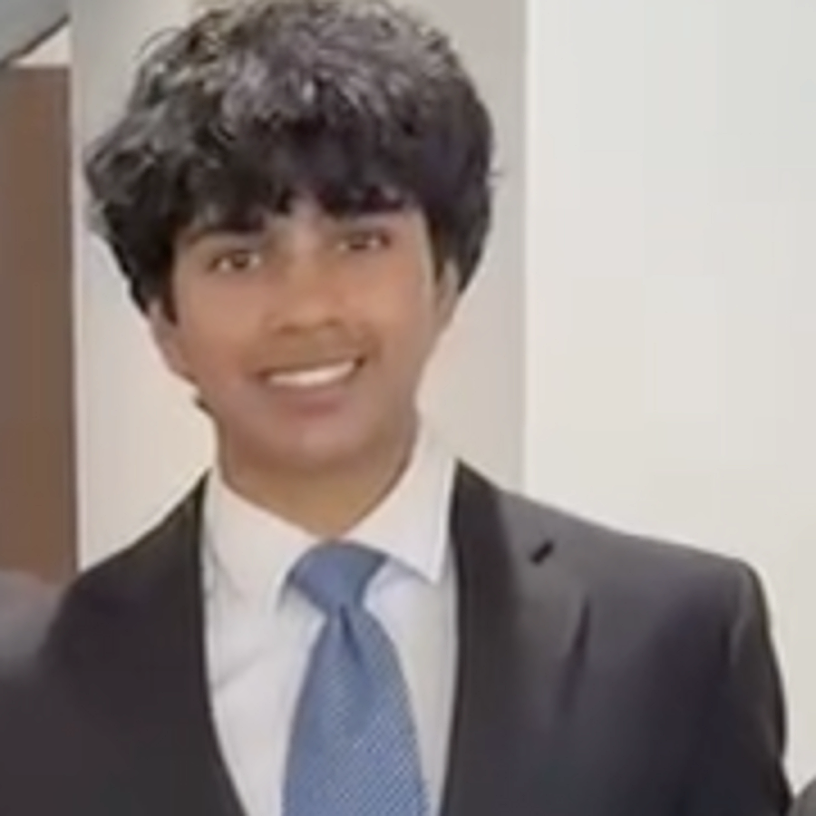 Saatvik Santosh in a blue tie and black suit.