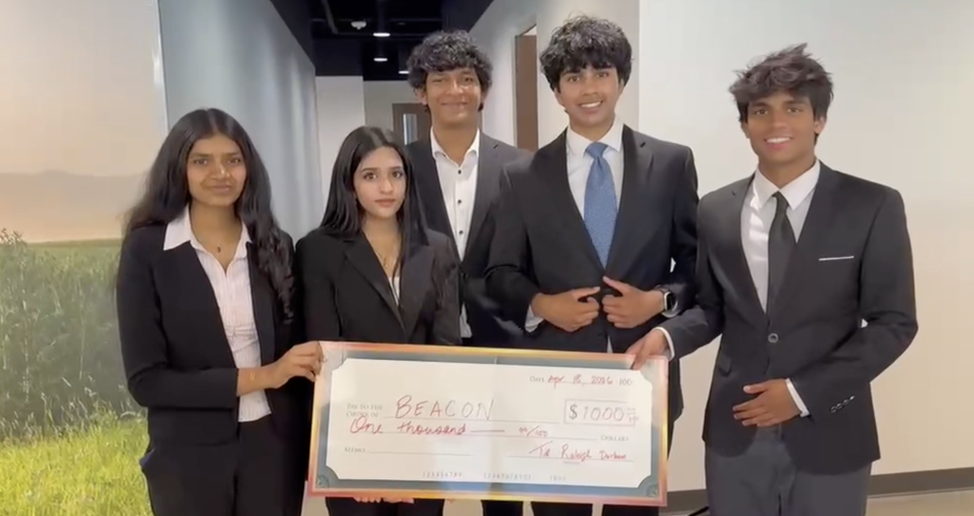 Project BEACON team lineup in formal presentation attire.